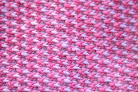 Isabella's blanket using Malabrigo merino yarn, shocking pink & orchid