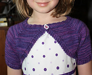 Child's Shrug shown in Malabrigo Worsted Yarn, color purple magic #609