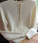 Hand-knit cardigan sweater with Malabrigo Merino Sock Yarn color natural